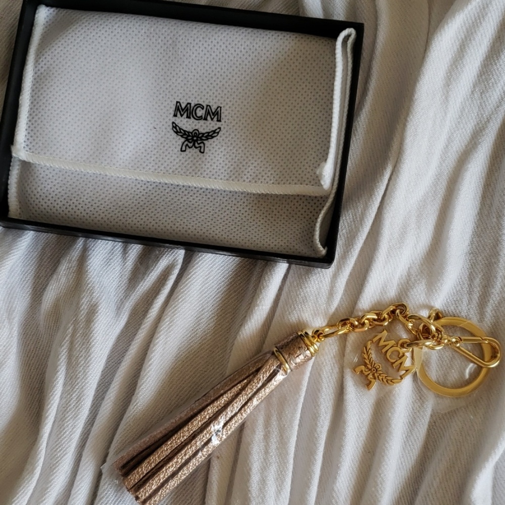MCM leather tassel keychain rose gikd